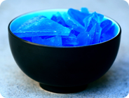 Blue Glass In Black Bowl